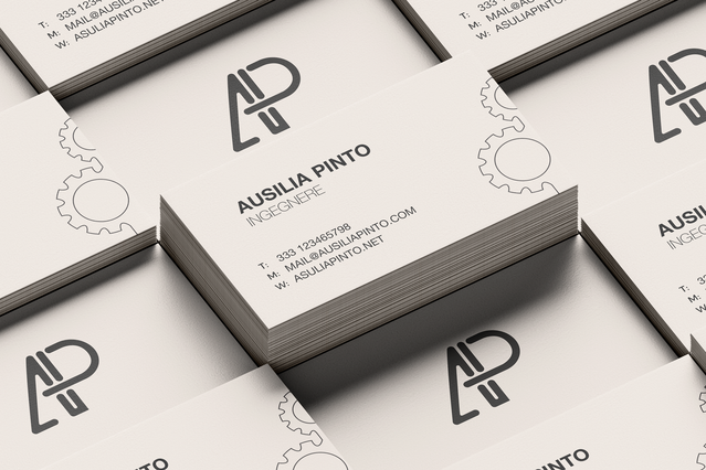 Una pila di biglietti da visita bianchi puliti per 'Ausilia Pinto, Ingegnere' con un logo monogramma 'AP' geometrico in grassetto e sottili icone di ingranaggi sullo sfondo. I biglietti da visita personalizzati per ingegneri con design minimalista professionale aiutano gli ingegneri civili, meccanici e informatici a fare un'ottima prima impressione e a costruire la propria rete professionale.