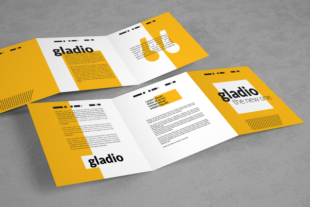 Due viste di un volantino piegato bifold giallo e bianco per il brand 'Gladio – The New One', con copertina e interno affiancati su superficie grigia. Sprint24 stampa volantini piegati personalizzati in 4 tipologie di piega e 5 formati standard su carta patinata 115 gr — ideali per lanci prodotto, menu ristorante e campagne pubblicitarie locali.